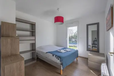 Un ou plusieurs lits dans un hébergement de l'établissement Les Vignets comfortable holiday home