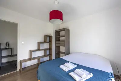 Un ou plusieurs lits dans un hébergement de l'établissement Les Vignets comfortable holiday home