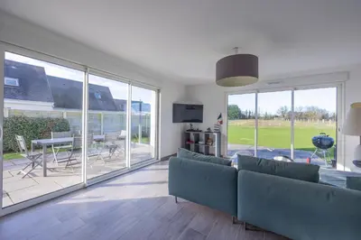 Coin salon dans l'établissement Les Vignets comfortable holiday home