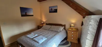 Un ou plusieurs lits dans un hébergement de l'établissement Gites Ferme de la Baie