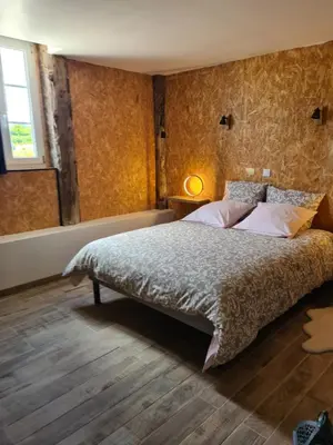 Un ou plusieurs lits dans un hébergement de l'établissement Gîte de L'Hotel Mahey