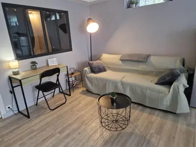 Coin salon dans l'établissement Appartement RDC Centre Cabourg