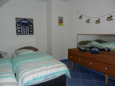 Un ou plusieurs lits dans un hébergement de l'établissement VILLA THEDIEBERT