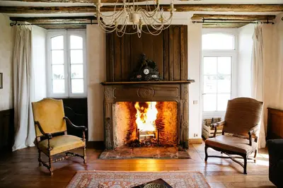 Coin salon dans l'établissement La Vieille Foulonnière : Chambres d'hôtes & Permaculture