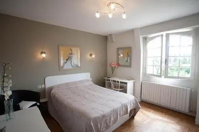 Un ou plusieurs lits dans un hébergement de l'établissement Chambres d'hôtes La Mansardière