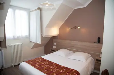 Un ou plusieurs lits dans un hébergement de l'établissement Hôtel La Pocatière
