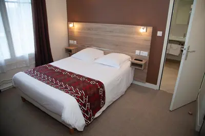 Un ou plusieurs lits dans un hébergement de l'établissement Hôtel La Pocatière