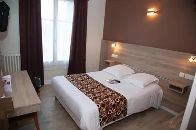 Un ou plusieurs lits dans un hébergement de l'établissement Hôtel La Pocatière