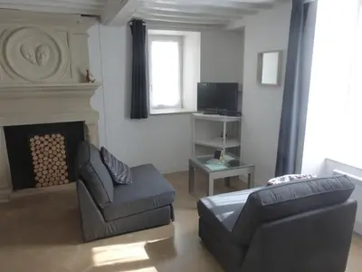 Coin salon dans l'établissement Gite LA CHARRETTERIE