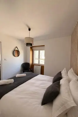 Un ou plusieurs lits dans un hébergement de l'établissement Flor du Mont Gîte