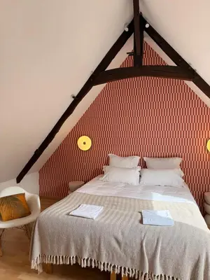 Un ou plusieurs lits dans un hébergement de l'établissement Flor du Mont Gîte