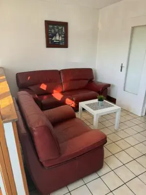 Coin salon dans l'établissement Appartement OMAHA BEACH