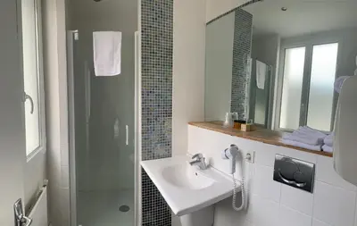 Salle de bains dans l'établissement Le Relais des Iles
