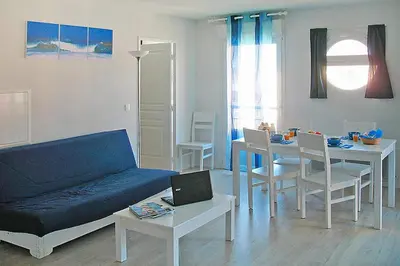 Coin salon dans l'établissement Les Isles de Sola apartment in Grandcamp