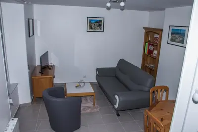 Coin salon dans l'établissement Maison gîte à Vire Normandie (Les Vaux de Vire)