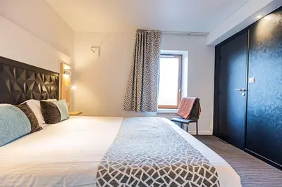 Un ou plusieurs lits dans un hébergement de l'établissement Best Western Le Moulin de Ducey
