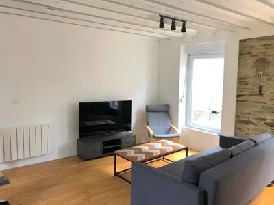 Télévision ou salle de divertissement dans l'établissement Le Duplex