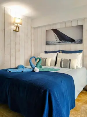Un ou plusieurs lits dans un hébergement de l'établissement Villa St Laurent - Bel appartement refait à neuf à 50 m de la Plage