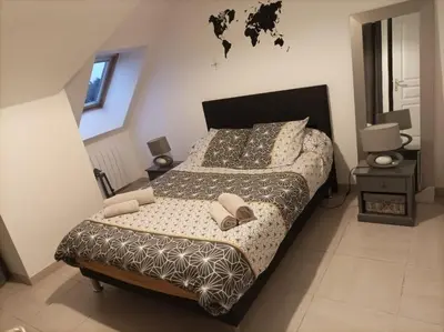 Un ou plusieurs lits dans un hébergement de l'établissement Appart. sur Caen avec Garage et Wifi.