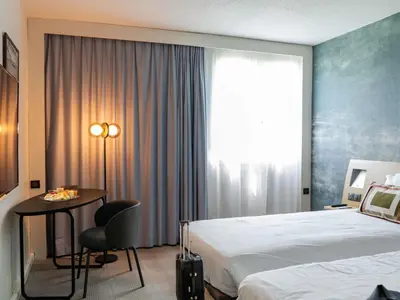 Un ou plusieurs lits dans un hébergement de l'établissement Novotel Bayeux