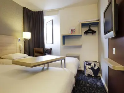 Un ou plusieurs lits dans un hébergement de l'établissement ibis Styles Ouistreham
