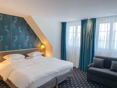 Un ou plusieurs lits dans un hébergement de l'établissement Best Western Royal Hotel Caen