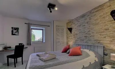 Un ou plusieurs lits dans un hébergement de l'établissement Chambres d'Hôtes Les Fleurettes en Baie Du Mont Saint Michel