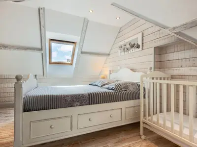 Un ou plusieurs lits dans un hébergement de l'établissement Holiday Home Zoé by Interhome