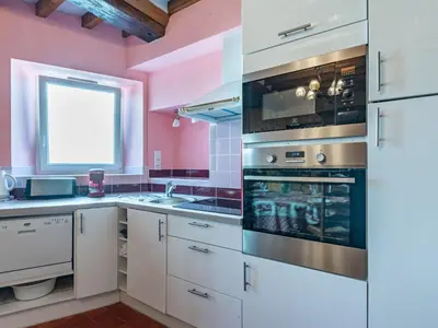 Cuisine ou kitchenette dans l'établissement Holiday Home Sténaïs by Interhome