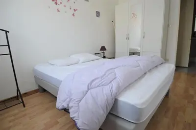 Un ou plusieurs lits dans un hébergement de l'établissement Appartement avec loggia - Proche centre et plage