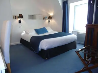 Un ou plusieurs lits dans un hébergement de l'établissement Best Western Hôtel Montgomery