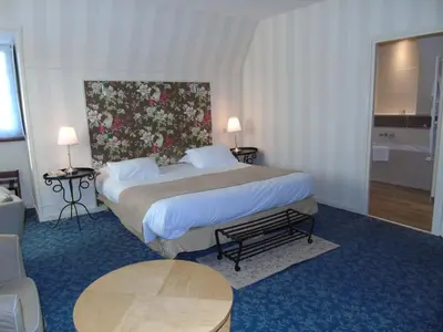 Un ou plusieurs lits dans un hébergement de l'établissement Best Western Hôtel Montgomery