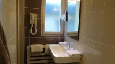 Salle de bains dans l'établissement Best Western Hôtel Montgomery