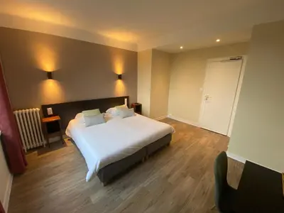Un ou plusieurs lits dans un hébergement de l'établissement Hotel De La Poste