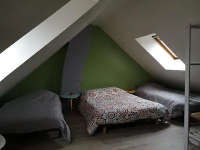 Un ou plusieurs lits dans un hébergement de l'établissement Holiday Home Maison de l'Océan à Denneville