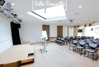 Coin salon dans l'établissement Sweet Home Cabourg Hôtel et gîtes