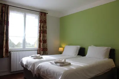 Un ou plusieurs lits dans un hébergement de l'établissement Le Clos Castel