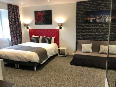 Un ou plusieurs lits dans un hébergement de l'établissement L' Annexe Beverl'inn appartement