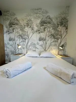 Un ou plusieurs lits dans un hébergement de l'établissement Hôtel Restaurant le clos de l 'Ancien Pressoir