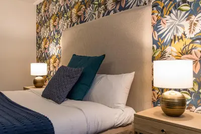 Un ou plusieurs lits dans un hébergement de l'établissement Hôtel restaurant l'Epicurien