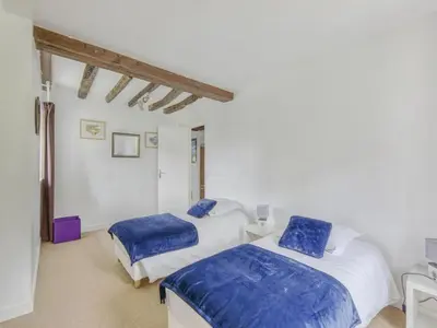 Un ou plusieurs lits dans un hébergement de l'établissement Cozy Normandy Escape