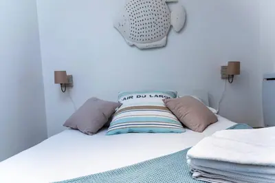 Un ou plusieurs lits dans un hébergement de l'établissement Appartement 2 personnes, Place St Sauveur à 2min