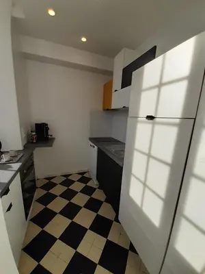 Cuisine ou kitchenette dans l'établissement La maison d'à côté