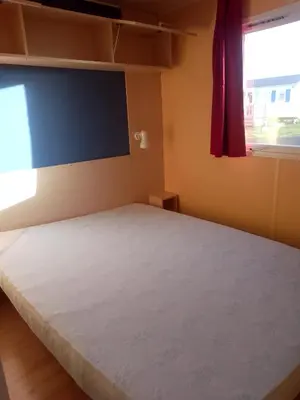 Un ou plusieurs lits dans un hébergement de l'établissement Camping La Baie du Mont Saint Michel