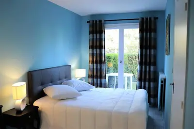 Un ou plusieurs lits dans un hébergement de l'établissement Appartement Cabourg près de la plage