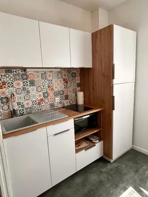 Cuisine ou kitchenette dans l'établissement 17 Rue du Puits de la Place