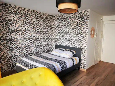 Un ou plusieurs lits dans un hébergement de l'établissement Studio Cosy Breizh