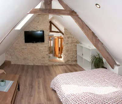 Télévision ou salle de divertissement dans l'établissement Logement cosy à proximité de Bayeux