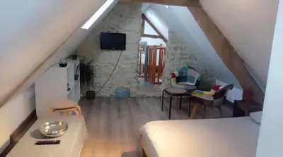 Télévision ou salle de divertissement dans l'établissement Logement cosy à proximité de Bayeux