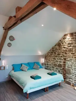 Un ou plusieurs lits dans un hébergement de l'établissement Le Cottage de L Abbaye